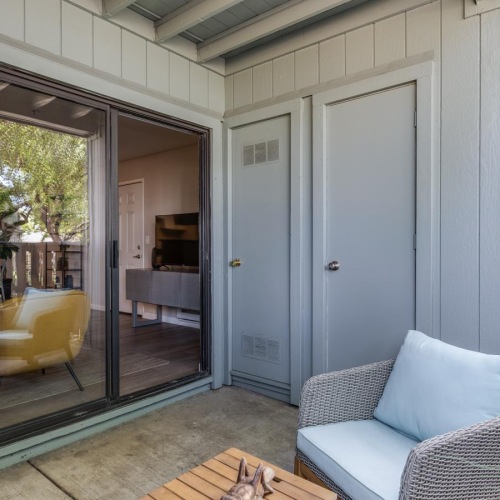 a living room with a glass door