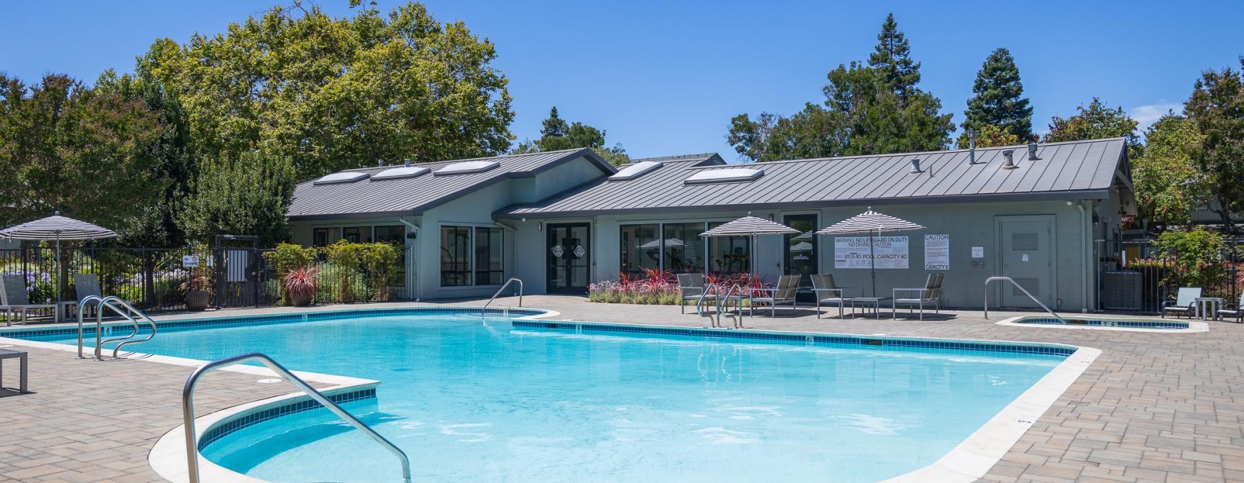 a swimming pool in front of a house