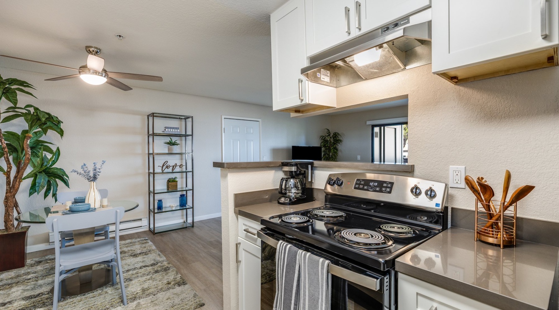 a kitchen with white cabinets